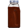 A clear plastic jar with a red powder inside and a blue lid that says Quality Sealed on it.