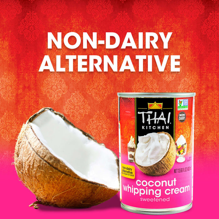 A can of Thai Kitchen coconut whipping cream is displayed next to a halved coconut highlighting its non-dairy alternative status.