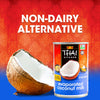 A can of Thai Kitchen evaporated coconut milk is displayed next to a halved coconut emphasizing its non-dairy alternative status.