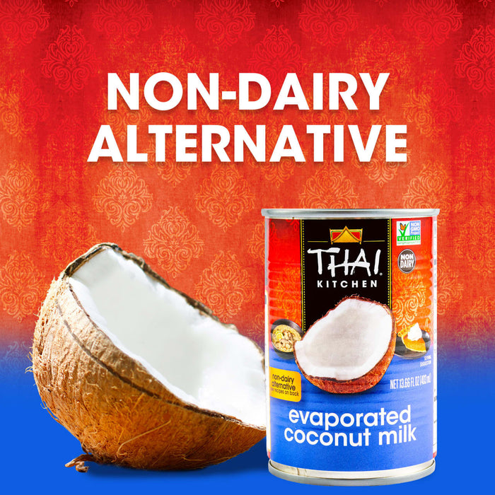 A can of Thai Kitchen evaporated coconut milk is displayed next to a halved coconut emphasizing its non-dairy alternative status.