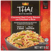 The red and black packaging for a box of Thai Kitchen, 9.0 Oz Coconut Red Curry Sauce with Chicken &amp; Rice features a serving suggestion of the meal in a black bowl.