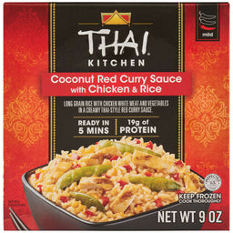 The red and black packaging for a box of Thai Kitchen, 9.0 Oz Coconut Red Curry Sauce with Chicken &amp; Rice features a serving suggestion of the meal in a black bowl.