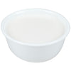 A white bowl filled with a white liquid.