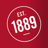 A white circle with the text EST. 1889 inside.