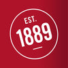 A white circle with the text EST. 1889 inside.