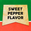 A vintage-style banner with the text Sweet Pepper Flavor in black letters on a yellow background.