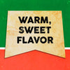 A vintage-style banner with the text Warm, Sweet Flavor on a yellowed background.