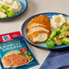 McCormick Cheddar Fried Onion Crunchy Chicken seasoning packet with a plate of breaded chicken, mashed potatoes and brussel sprouts.