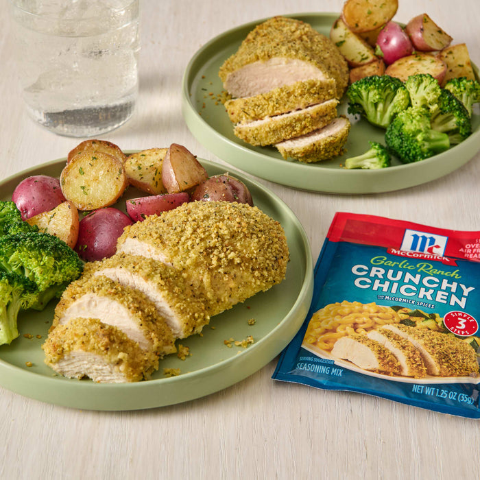 McCormick Garlic Ranch Crunchy Chicken seasoning packet with a plate of breaded chicken, potatoes, and broccoli.