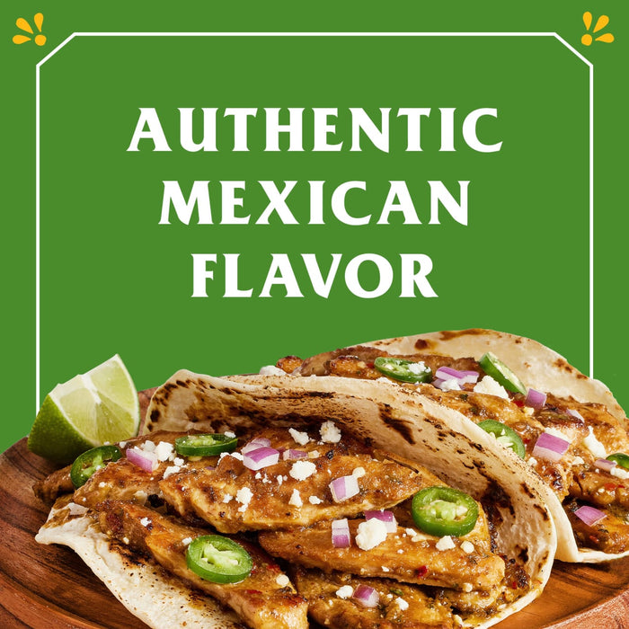 Two tacos filled with chicken cheese onions and jalapenos with the words Authentic Mexican Flavor in a green box.