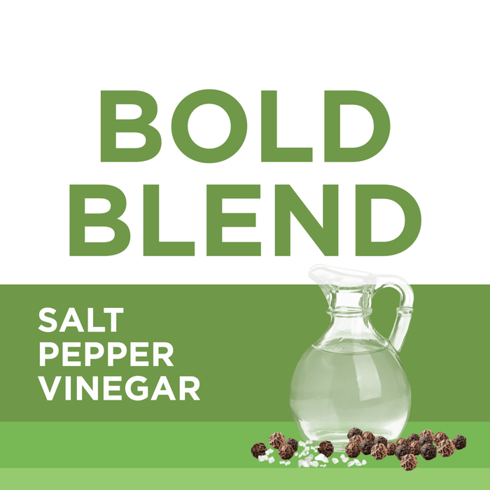 A glass pitcher of vinegar with salt and peppercorns on a green background with the text BOLD BLEND SALT PEPPER VINEGAR