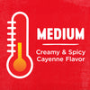 A white thermometer with a red background and the words Medium Creamy &amp; Spicy Cayenne Flavor in white.