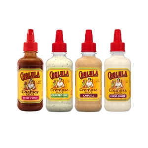 Four bottles of Cholula sauce are lined up against a white background, featuring the Chamoy Sweet &amp; Spicy, Cremosa Cilantro Lime, Cremosa Chipotle, and Cremosa Cotija Cheese flavors.