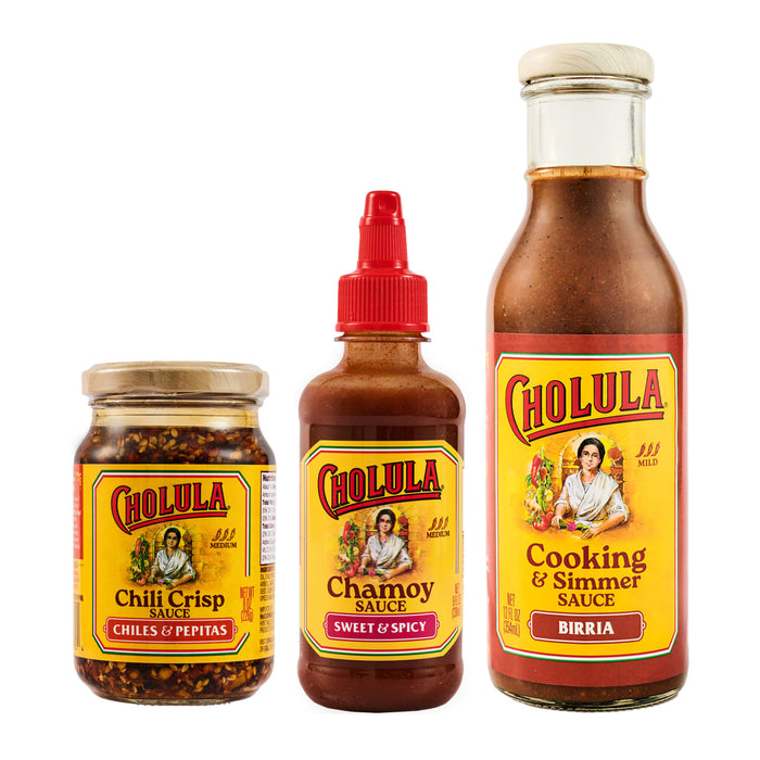 A variety of Cholula brand hot sauce products are displayed, including chili crisp, chipotle hot sauce, and cooking sauce.