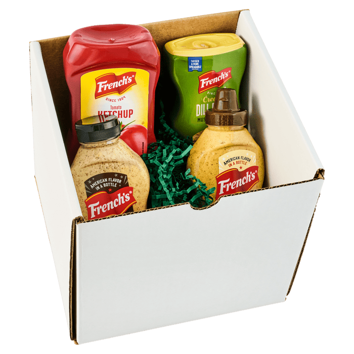 A gift box containing various bottles of French's condiments, including ketchup, mustard, and relish.