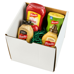 A gift box containing assorted bottles of Renette brand condiments, including ketchup, mustard, and relish.