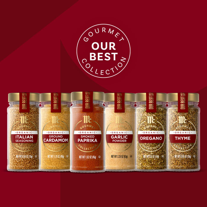 A collection of Gourmet Our Best spices in glass jars with gold lids, showcasing a variety of flavors.