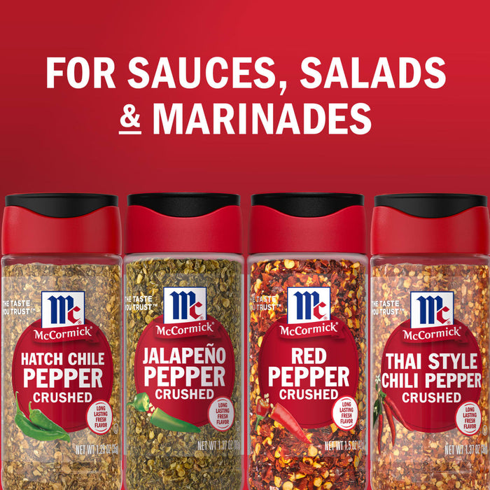 Four bottles of McCormick crushed pepper spices including hatch chile jalapeA?o red pepper and Thai style chili pepper are displayed with the text For Sauces Salads &amp; Marinades.