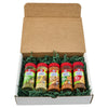 A gift box containing five McCormick spice bottles nestled in green filler.