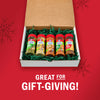 A McCormick spice gift set is displayed in a box with green filler, perfect for gift-giving.