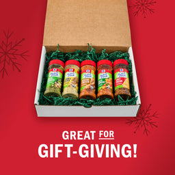 A McCormick spice gift set is displayed in a box with green filler, perfect for gift-giving.
