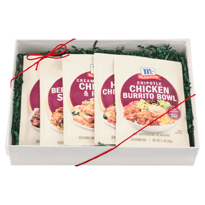 A gift box containing four McCormick Chicken Burrito Bowl seasoning packets.