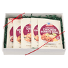 A gift box containing four McCormick Chicken Burrito Bowl seasoning packets.