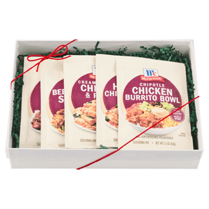 A gift box containing four McCormick Chicken Burrito Bowl seasoning packets.