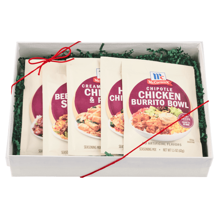 A gift box containing four McCormick Chicken Burrito Bowl seasoning packets.