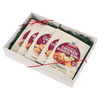 A gift box containing four packets of McCormick Chicken Roasted Gravy mix.