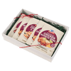 A gift box containing four packets of McCormick Chicken Roasted Gravy mix.
