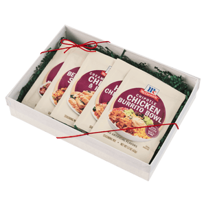 A gift box containing four packets of McCormick Chicken Roasted Gravy mix.