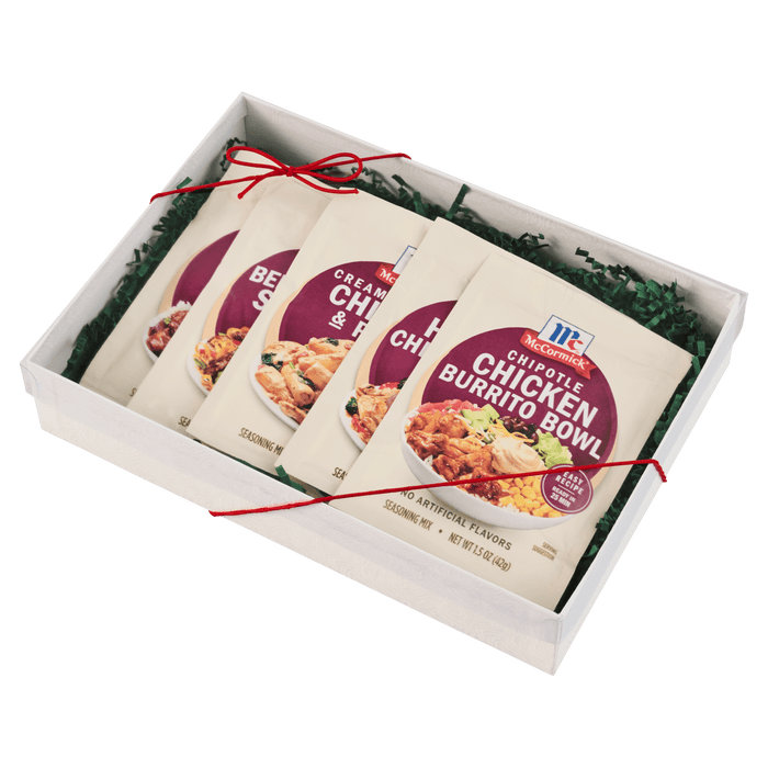 A gift box containing four packets of McCormick Chicken Roasted Gravy mix.
