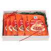 A gift box containing multiple packets of McCormick Slow Cooker Pulled Pork seasoning mix.