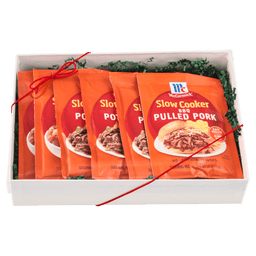 A gift box containing multiple packets of McCormick Slow Cooker Pulled Pork seasoning mix.
