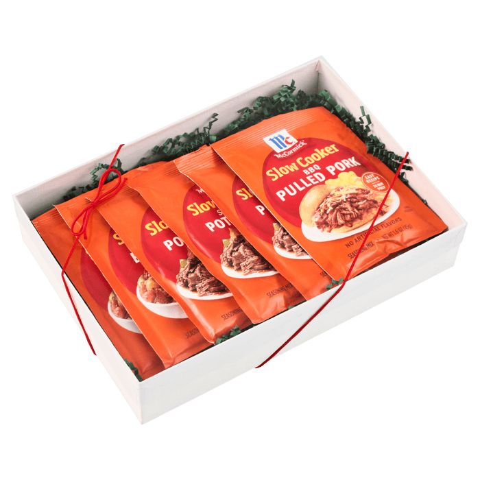 A gift box containing several packets of McCormick Polish Kielbasa Sausage Seasoning Mix.