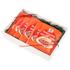 A gift box containing multiple packets of McCormick Slow Cooker Pulled Pork seasoning mix.