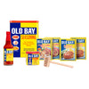 A collection of Old Bay seasoning products, including the classic seasoning, hot sauce, crab cake mix, and a wooden mallet.