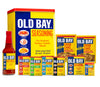 A collection of Old Bay seasoning products, including the classic seasoning, hot sauce, crab cake mix, and a wooden mallet.