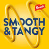 A Frenchs mustard advertisement featuring the words Smooth &amp; Tangy written in blue over a yellow background with mustard swirls.