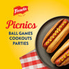 Frenchs mustard is perfect for picnics ball games cookouts and parties as shown in this image of two hot dogs topped with mustard on a plate.