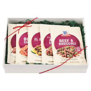 A gift box containing an assortment of McCormick seasoning packets.
