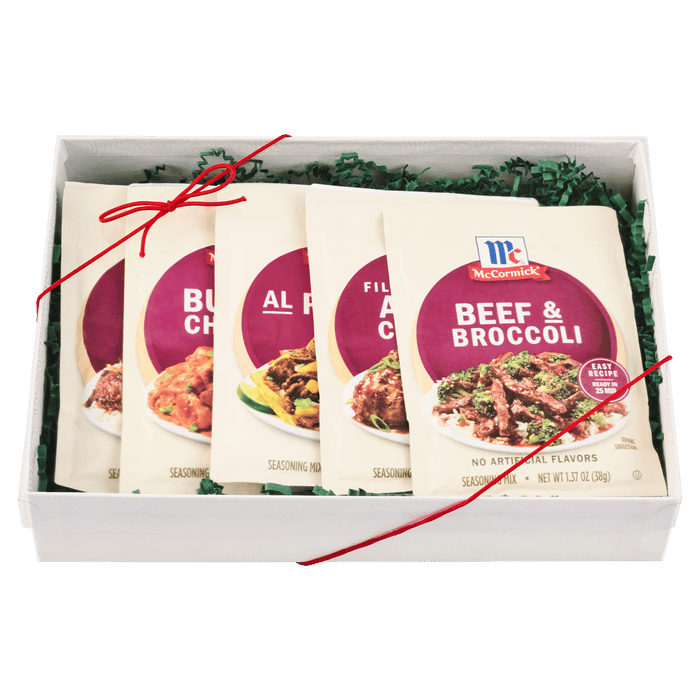 A gift box containing an assortment of McCormick seasoning packets.