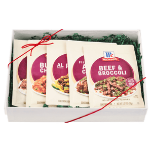 A gift box containing an assortment of McCormick seasoning packets.