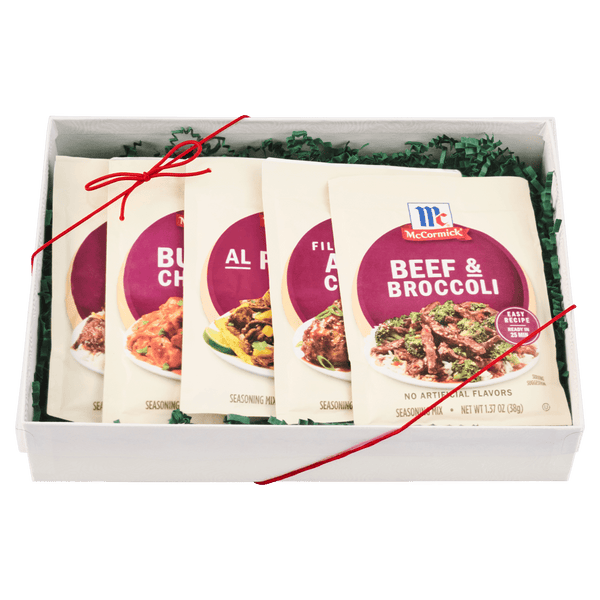 A gift box containing an assortment of McCormick seasoning packets.