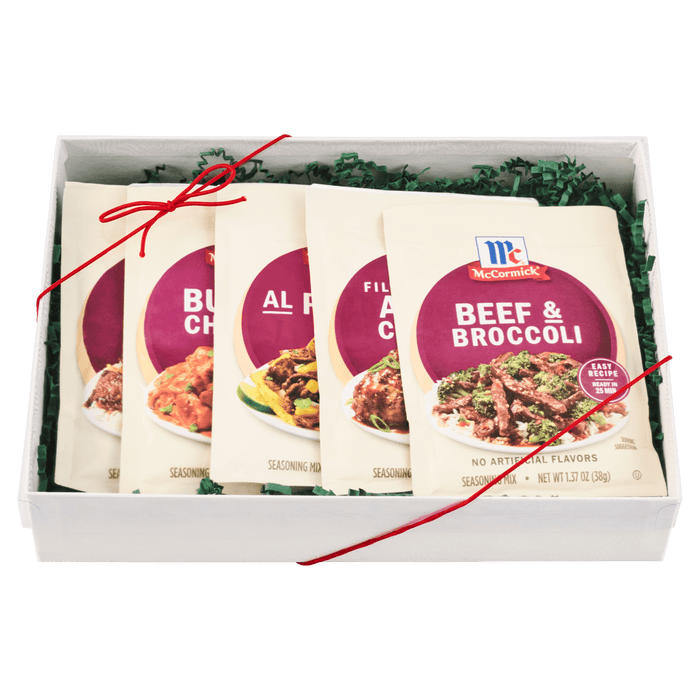 A gift box containing an assortment of McCormick seasoning packets.