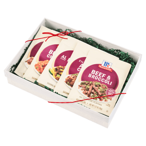 A gift box containing McCormick seasoning packets for various dishes.