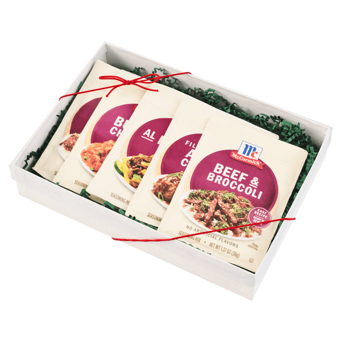 A gift box containing McCormick seasoning packets for various dishes.