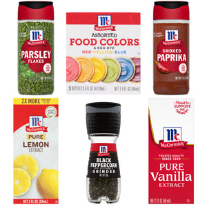 A collection of McCormick spices and extracts including parsley flakes assorted food colors smoked paprika pure lemon extract black peppercorn grinder and pure vanilla extract.