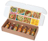 An open gift box reveals a variety pack of Cholula Hot Sauces, with the inside lid featuring inspiring Mexican recipes and a heat scale for the different flavors.